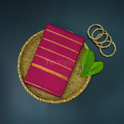 Maroon Silk Saree with Gold Zari Stripes – A Statement of Grace