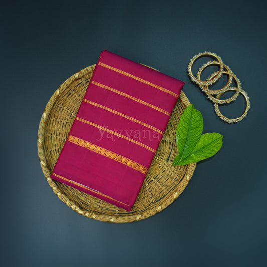 Maroon Silk Saree with Gold Zari Stripes – A Statement of Grace