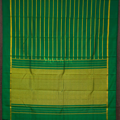 Forest Green Silk Saree with Gold Zari Stripes – A Statement of Grace