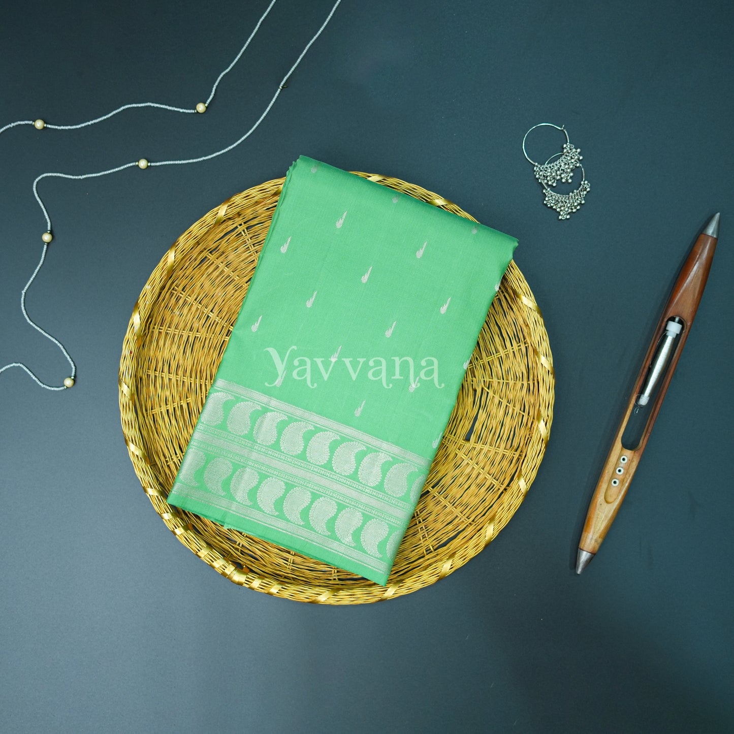 Graceful Green Silk Saree in Silver Zari Accents